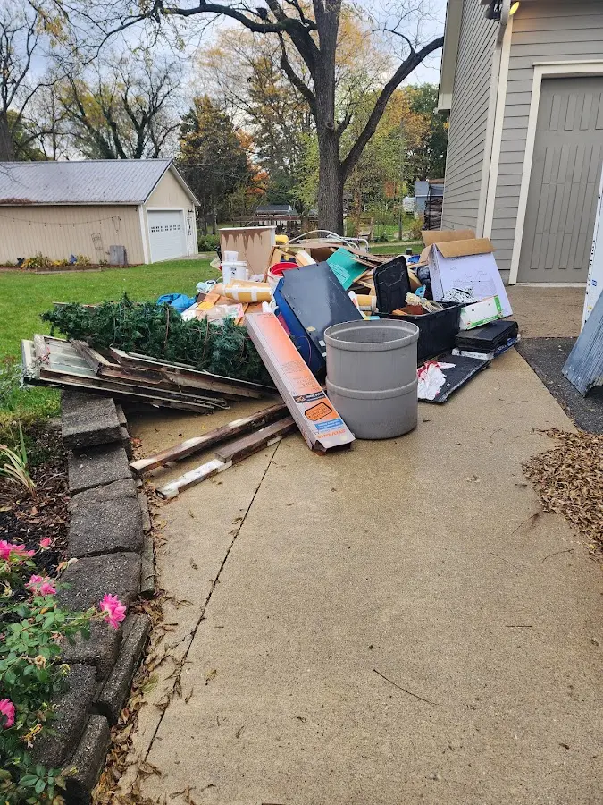 Dumpster being loaded with debris for Demolition Dumpster Rental in Flossmoor